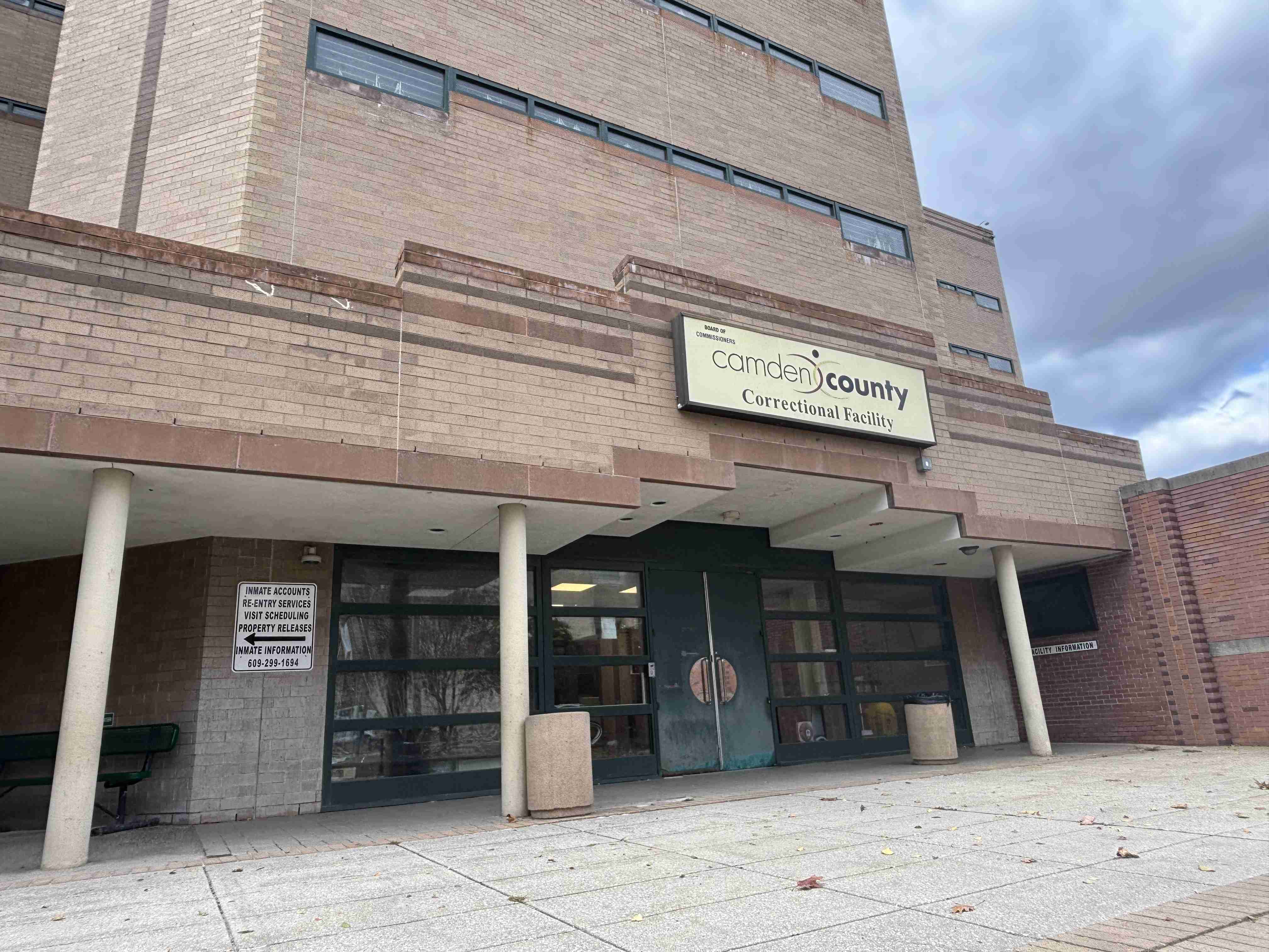 The front entrance of the Camden County Correctional Facility, a multi-story tan brick building